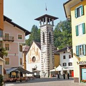 Fiera di Primiero torre civica e chiesa madonna aiuto