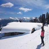 vista di Malga Bolentina Alta e sullo sfondo il Monte Peller e il Sasso Rosso