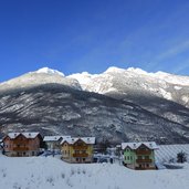 alba a spormaggiore con monte corona e cima sporata inverno