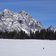 calaita inverno escursionista con ciaspole sfondo pale di san martino